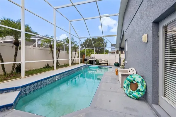 a view of a swimming pool with a patio
