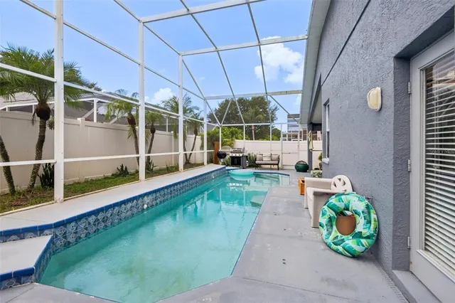 a view of a swimming pool with a patio