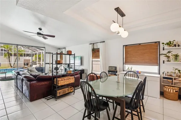 a dining room with furniture and window