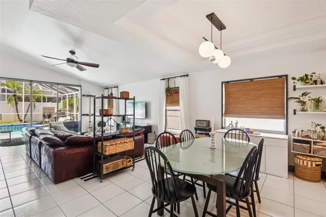 a dining room with furniture and window
