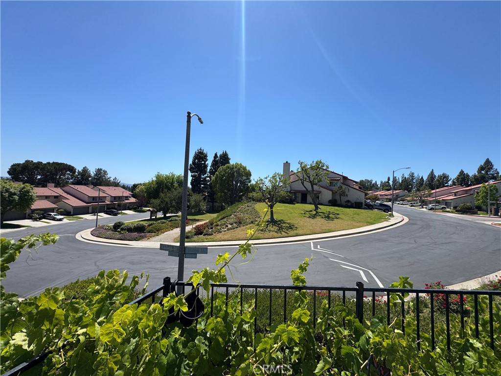 19133 Index Street, Unit 1 Porter Ranch, CA 91326 - Photo 17 of 24 a view of a swimming pool and a lawn chairs
