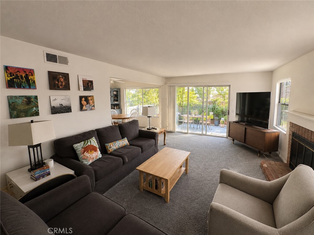 19133 Index Street, Unit 1 Porter Ranch, CA 91326 - Photo 3 of 24 a living room with furniture and a flat screen tv