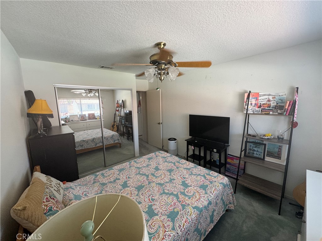 19133 Index Street, Unit 1 Porter Ranch, CA 91326 - Photo 7 of 24 a bedroom with bed tv and window