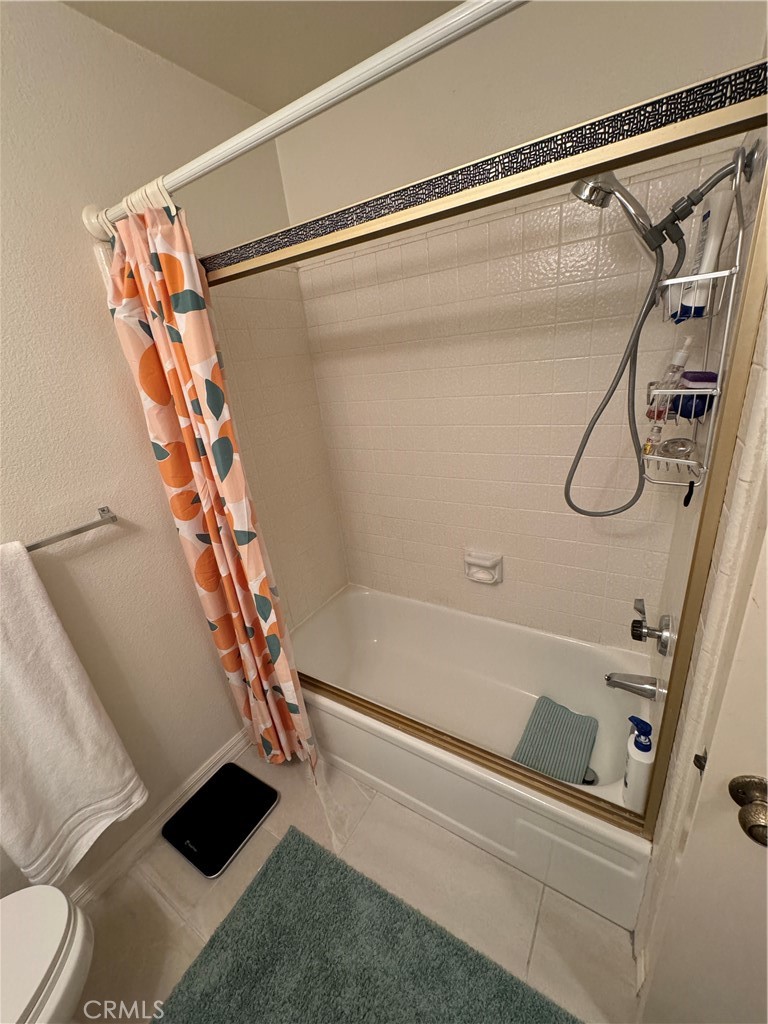 19133 Index Street, Unit 1 Porter Ranch, CA 91326 - Photo 9 of 24 a bathroom with a shower and a glass door