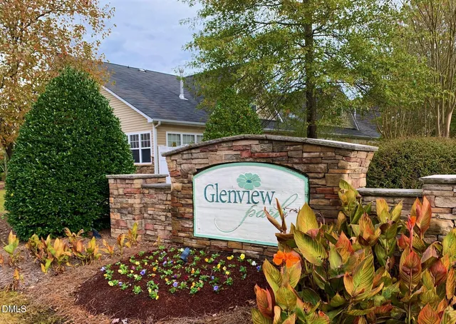 a view of outdoor space with signage and flags