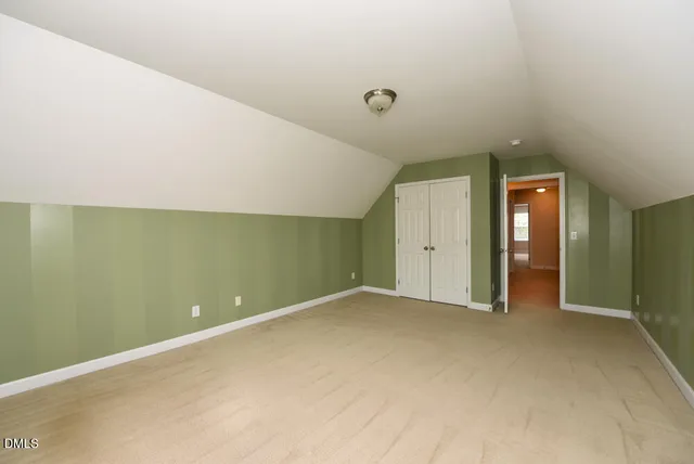 an empty room with closet area