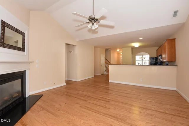 a view of a kitchen with a stove cabinets and wooden floor