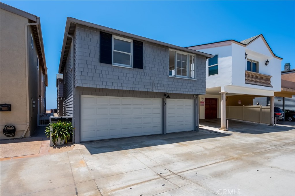 1708 West Oceanfront, Unit B Newport Beach, CA 92663 - Photo 11 of 14 a front view of a house with yard