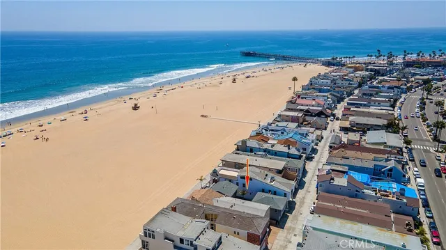a view of an ocean beach and city