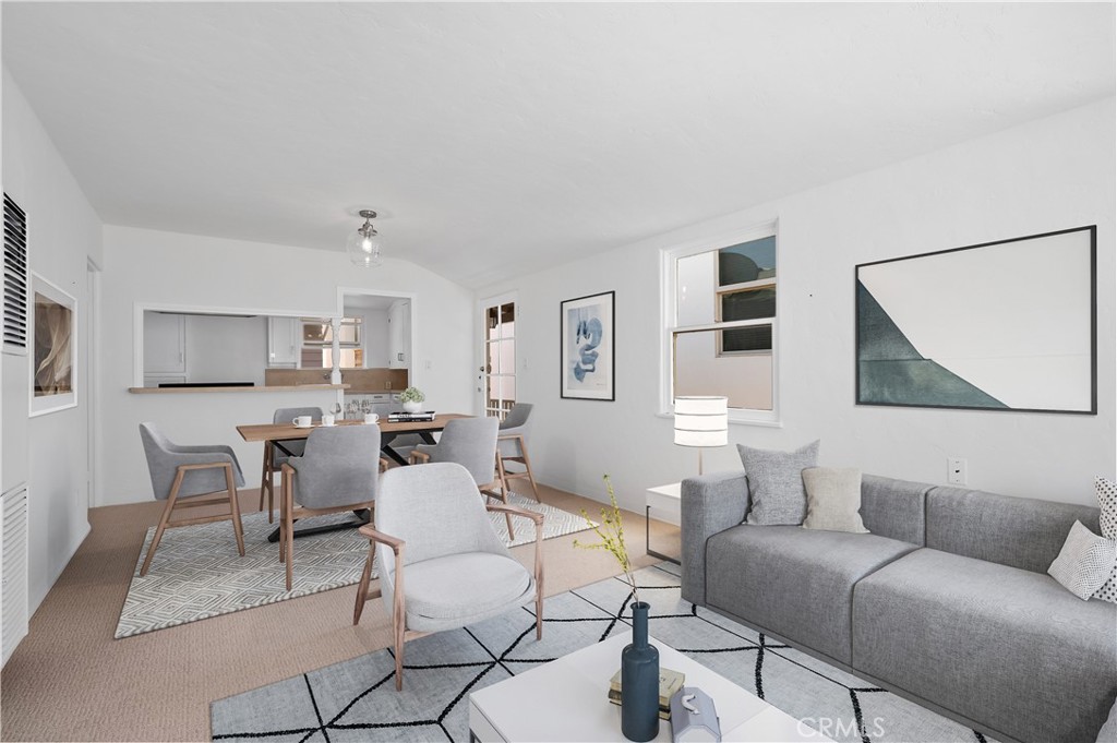 1708 West Oceanfront, Unit B Newport Beach, CA 92663 - Photo 4 of 14 a living room with furniture and a table