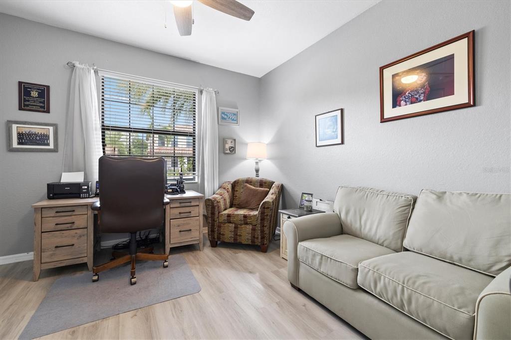 12675 Richezza Drive Venice, FL 34293 - Photo 24 of 60 a living room with furniture and a window