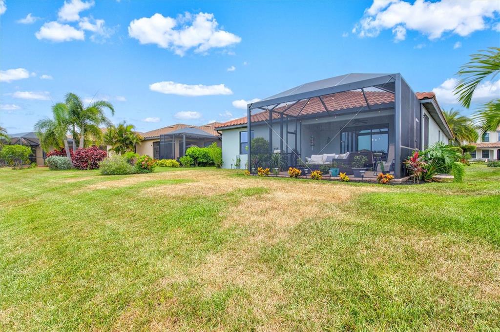 12675 Richezza Drive Venice, FL 34293 - Photo 35 of 60 a view of a house with a big yard