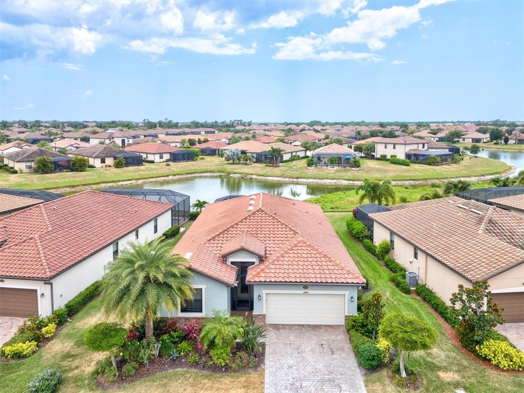 12675 Richezza Drive Venice, FL 34293 - Photo 37 of 60 an aerial view of a house with outdoor space and lake view in back