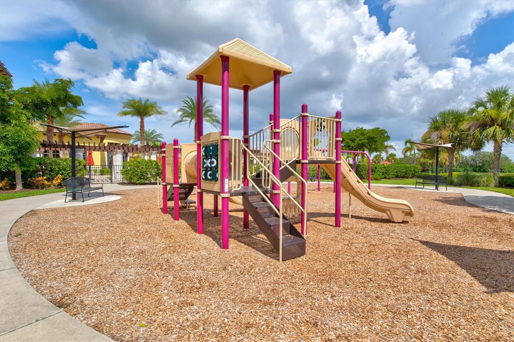 12675 Richezza Drive Venice, FL 34293 - Photo 43 of 60 a view of a park with swings and slides