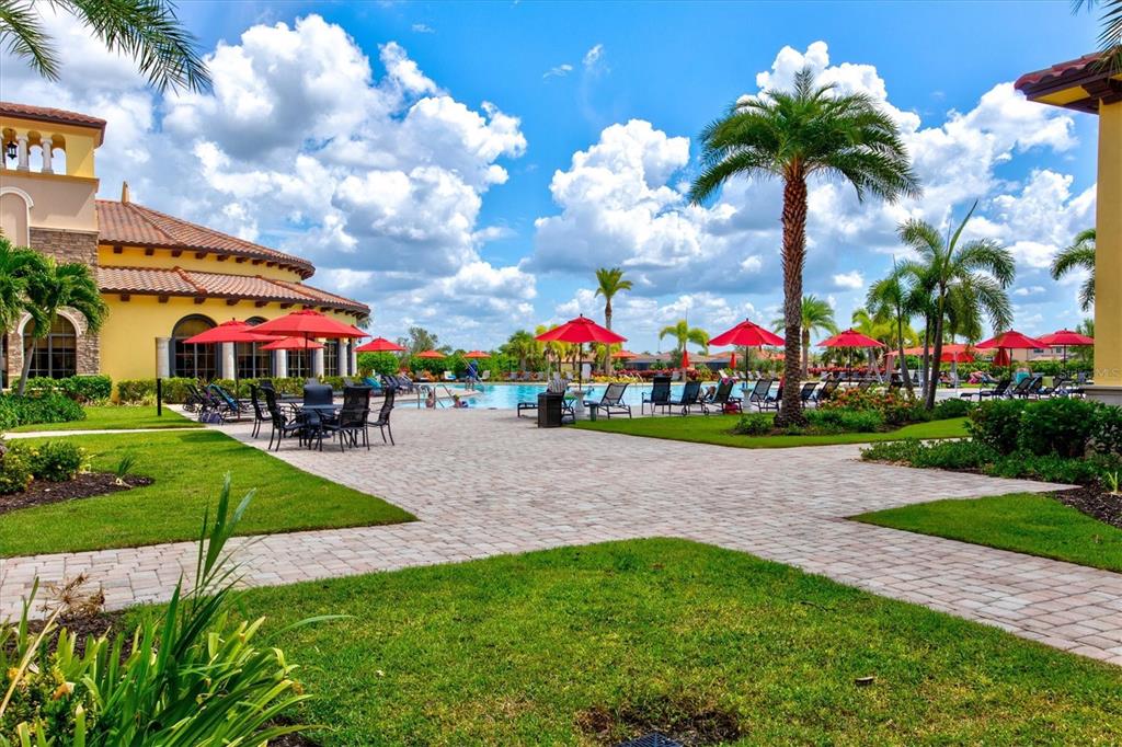 12675 Richezza Drive Venice, FL 34293 - Photo 44 of 60 a childrens park with lots of swings and slides