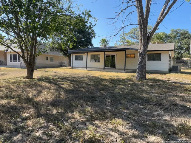 a house with trees in front of it