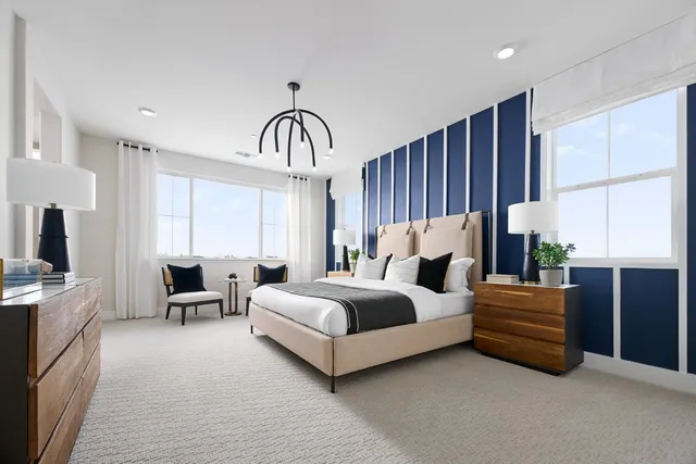 a bed room with furniture and a large window