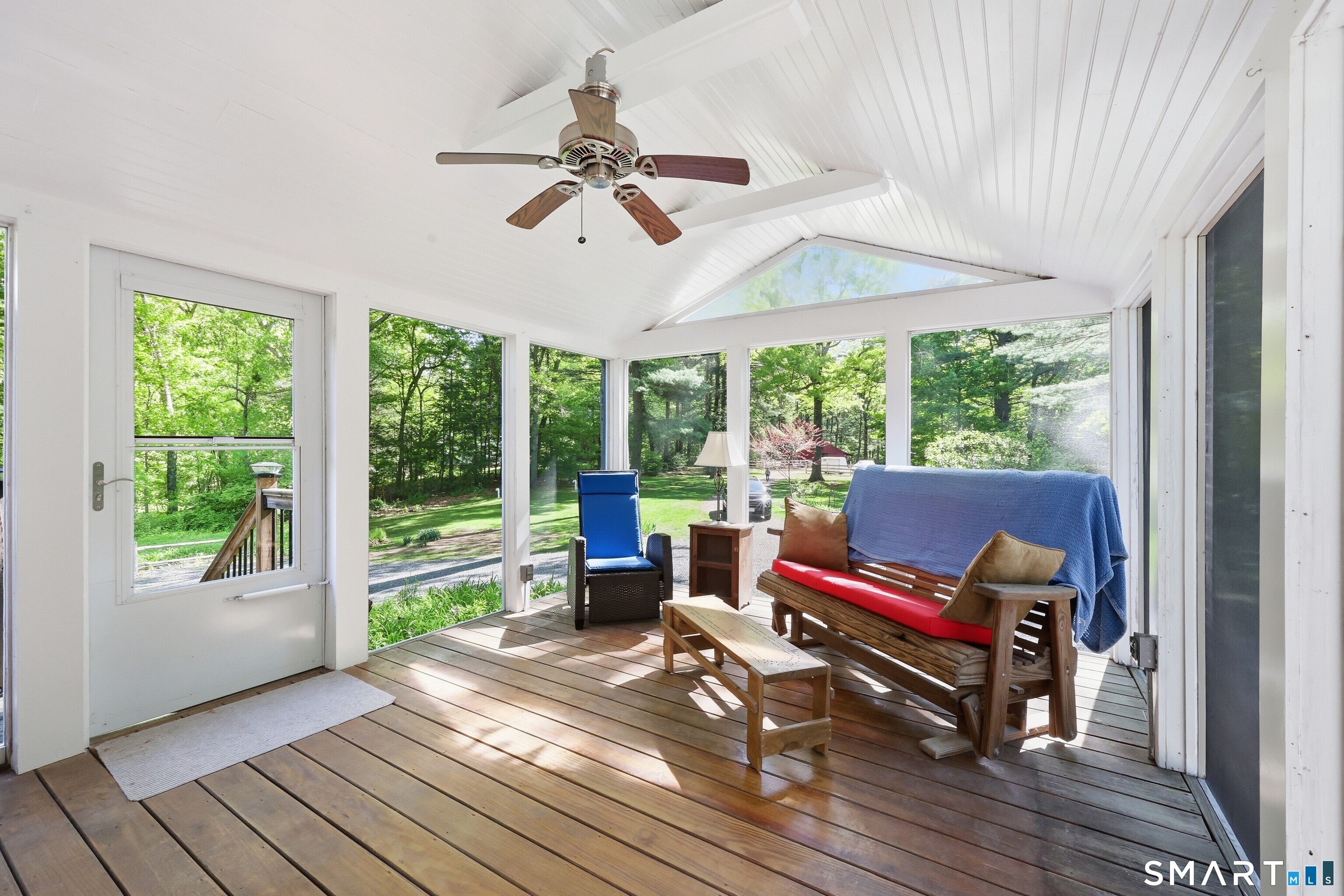 174 Canton Road Granby, CT 06035 - Photo 20 of 35 a living room with furniture and a floor to ceiling window