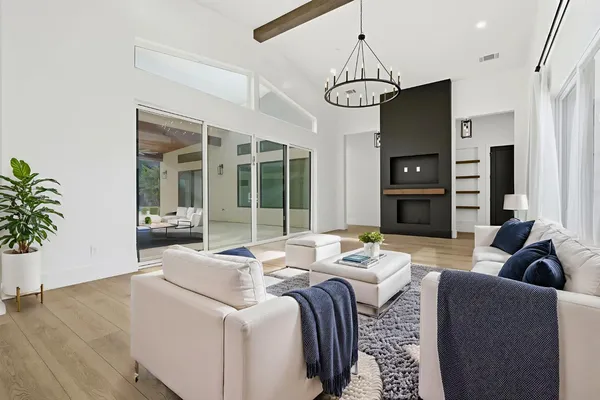 a dining room with furniture and wooden floor