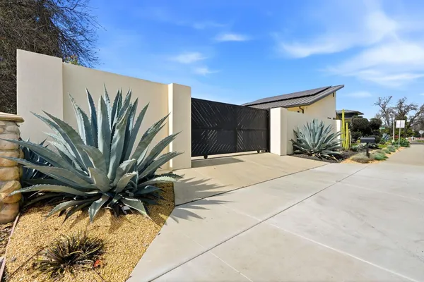 a view of a room with a wooden floor and door