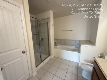 700 Mandarin Flyway, Unit 502 Cedar Park, TX 78613 - Photo 15 of 25 a bathroom with a bathtub and a shower