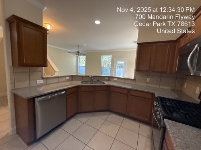 700 Mandarin Flyway, Unit 502 Cedar Park, TX 78613 - Photo 3 of 25 a kitchen with a sink and cabinets