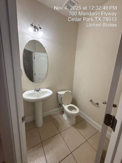 700 Mandarin Flyway, Unit 502 Cedar Park, TX 78613 - Photo 9 of 25 a bathroom with a toilet sink and mirror