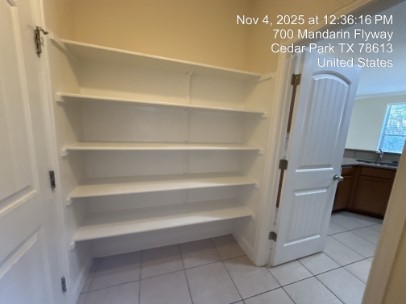 700 Mandarin Flyway, Unit 502 Cedar Park, TX 78613 - Photo 10 of 25 a view of walk in closet with empty racks