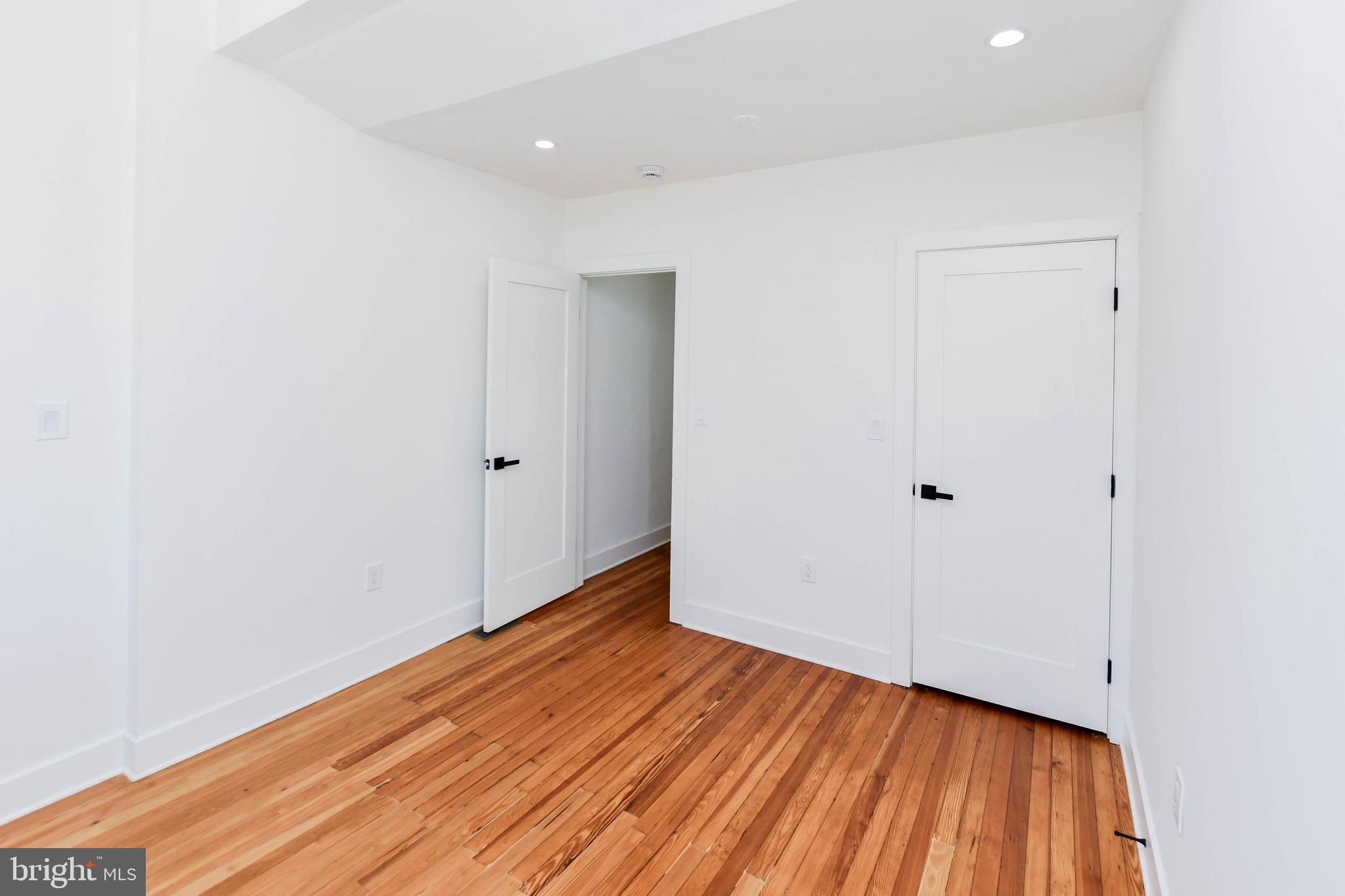104 R Street Northeast, Unit A Washington, DC 20002 - Photo 23 of 43 a view of room with wooden floor