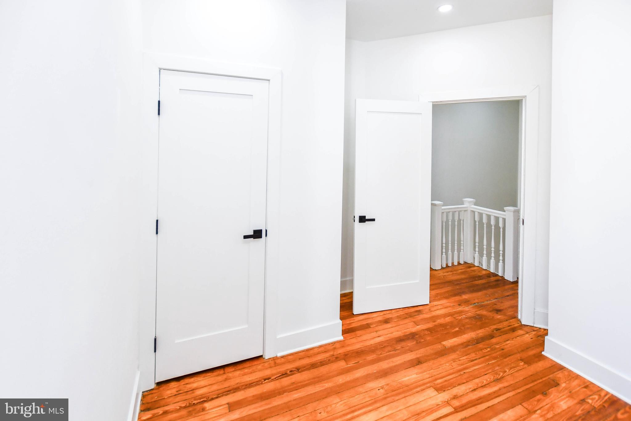 104 R Street Northeast, Unit A Washington, DC 20002 - Photo 29 of 43 a view of a bedroom with wooden floor