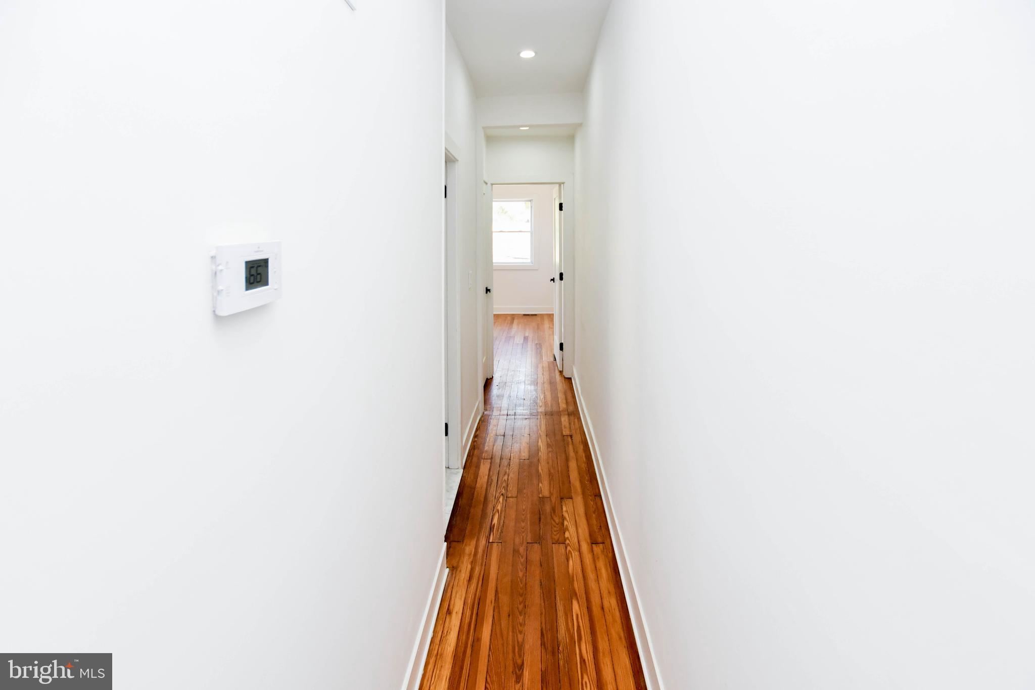 104 R Street Northeast, Unit A Washington, DC 20002 - Photo 37 of 43 a view of a hallway with wooden floor