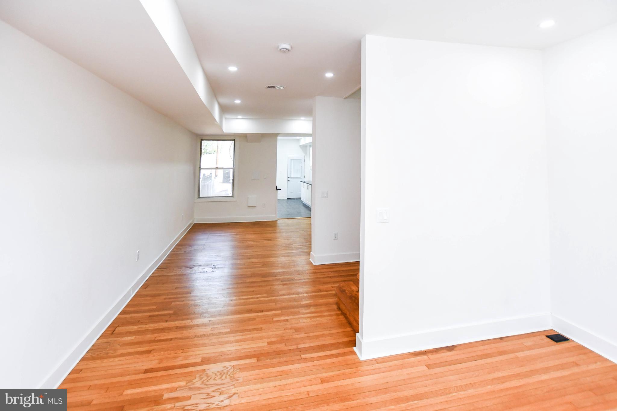104 R Street Northeast, Unit A Washington, DC 20002 - Photo 5 of 43 a view of a hallway with wooden floor