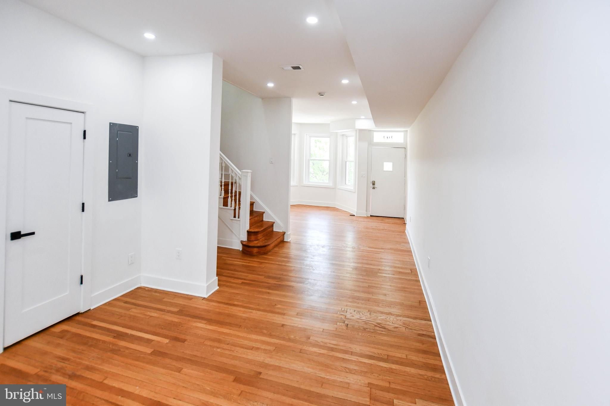 104 R Street Northeast, Unit A Washington, DC 20002 - Photo 8 of 43 a view of an empty room with wooden floor