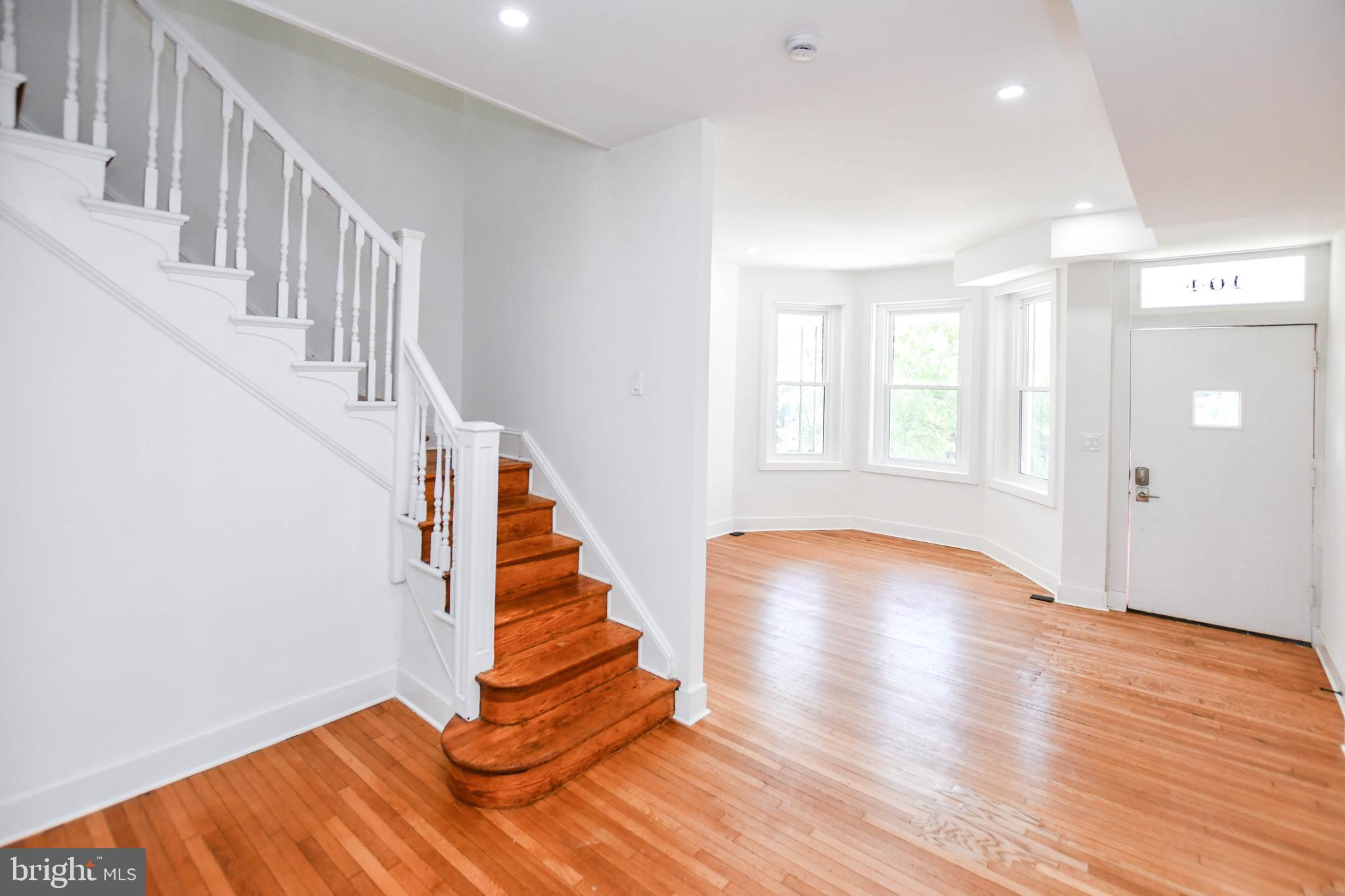 104 R Street Northeast, Unit A Washington, DC 20002 - Photo 9 of 43 a view of entryway with wooden floor and stairs