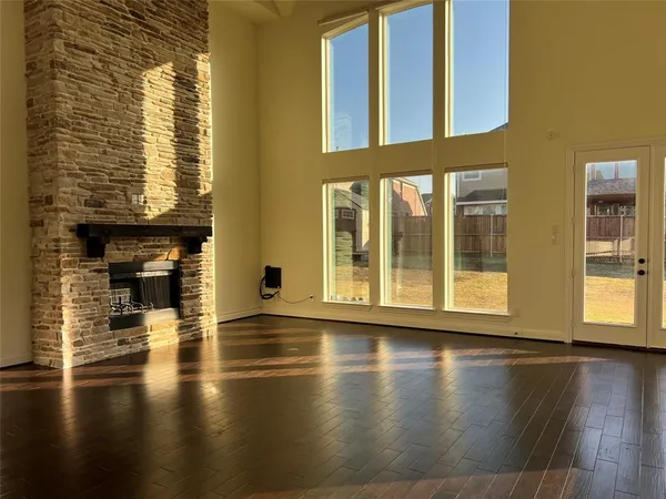 a view of an entryway with wooden floor