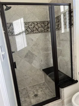 view of a room with wooden floor and tub