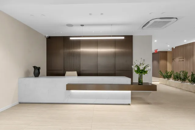 a couple of cars parked in front of brick building