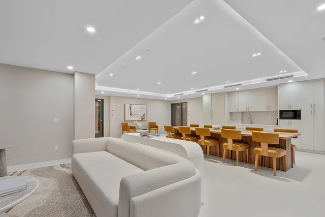 a living room with lots of furniture and a chandelier
