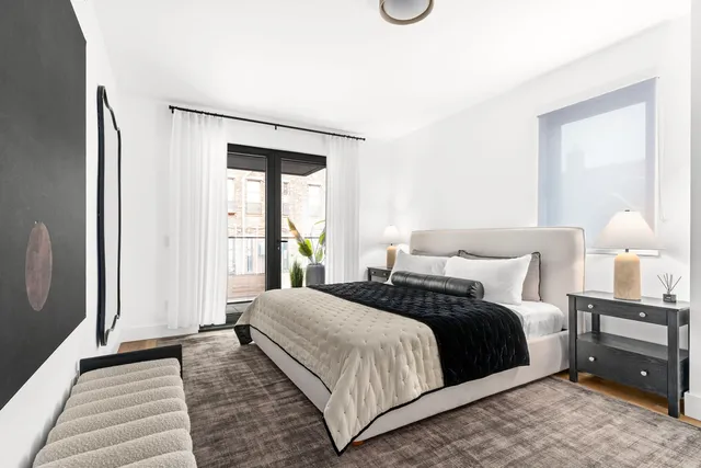 a living room with furniture potted plant and a window