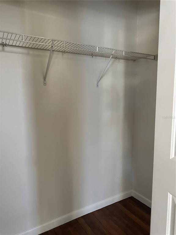 32 Southeast 9th Avenue, Unit 1B Ocala, FL 34471 - Photo 6 of 7 a view of a room with racks on the wall