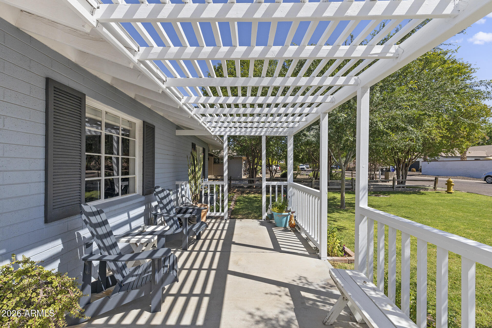 5228 North 15th Street Phoenix, AZ 85014 - Photo 12 of 96 a porch with a table and chairs