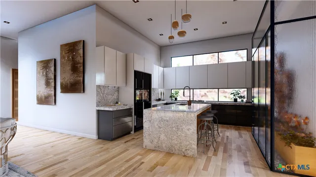 a kitchen with a sink appliances and cabinets