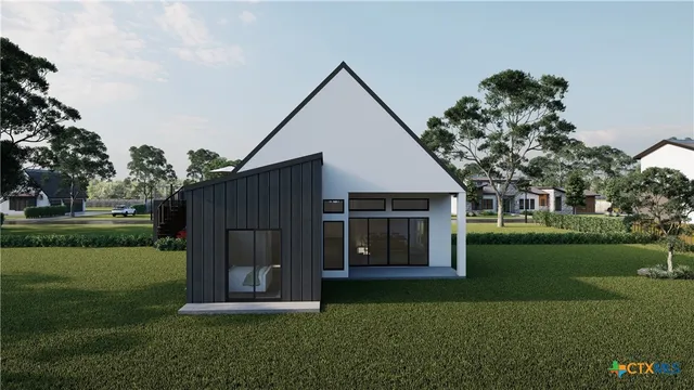 a view of a house with backyard and garden