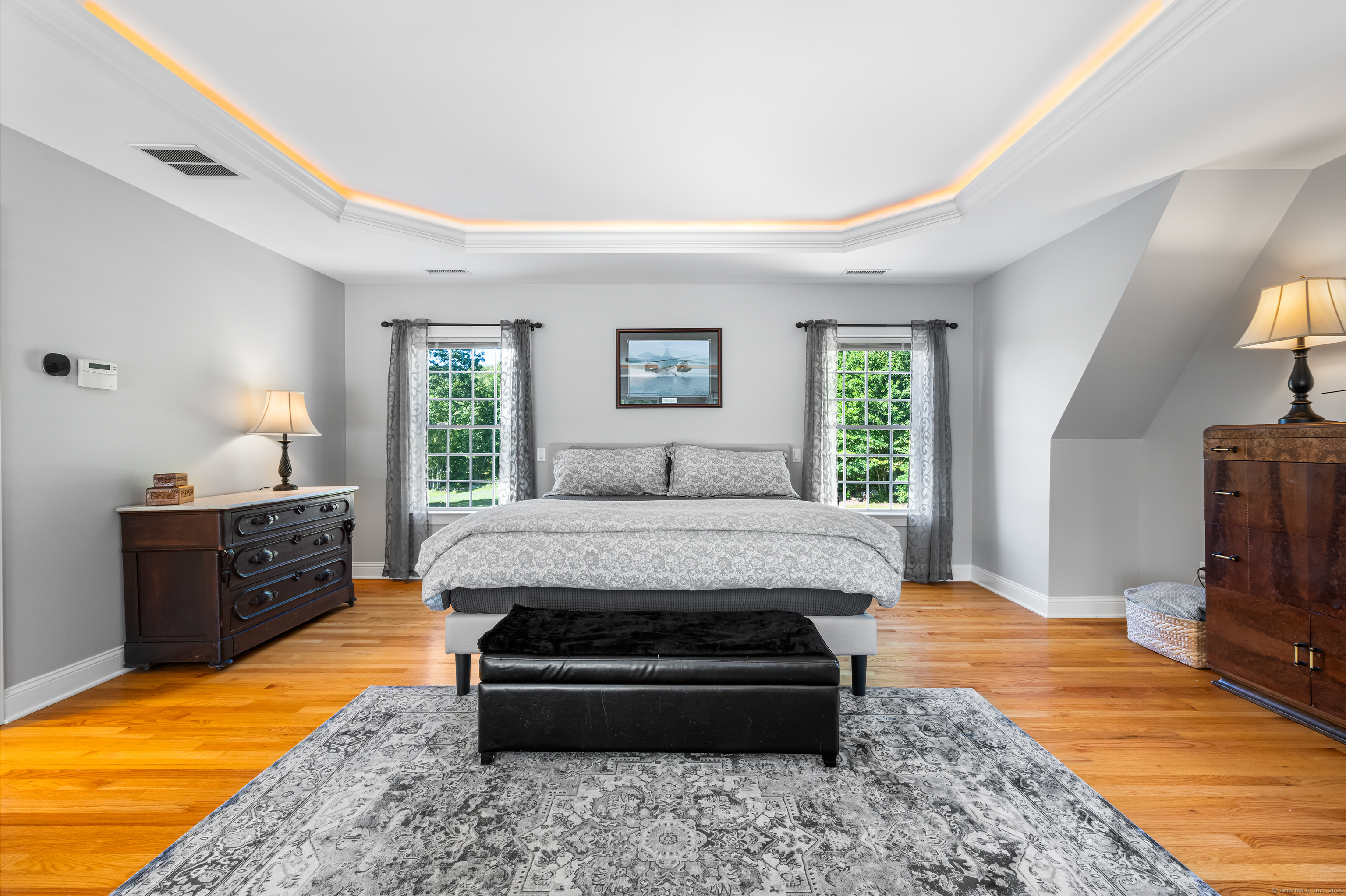 23 Olmstead Road East Haddam, CT 06423 - Photo 17 of 38 a spacious bedroom with a bed and wooden floor