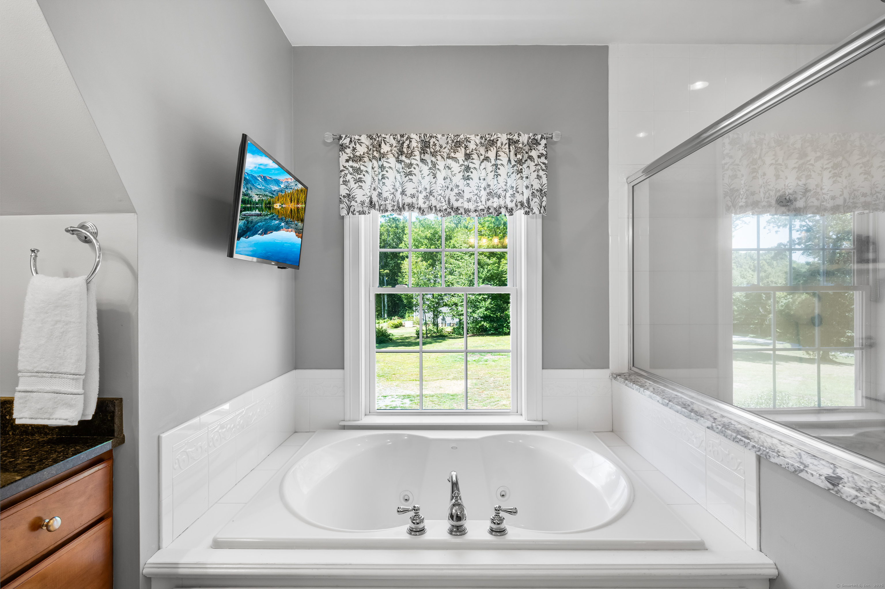 23 Olmstead Road East Haddam, CT 06423 - Photo 22 of 38 a bathroom with bathtub and window