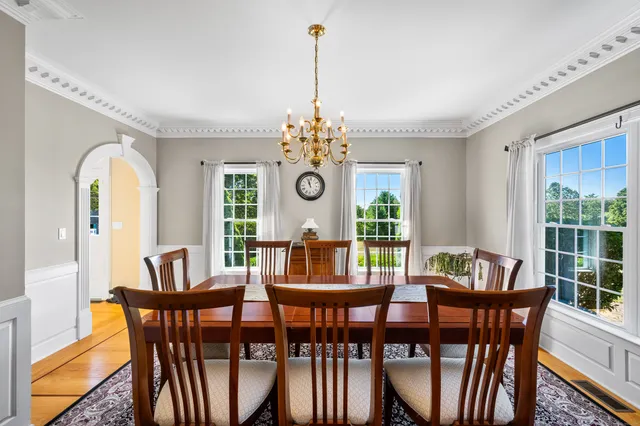 a view of a dining room with furniture window and outside view