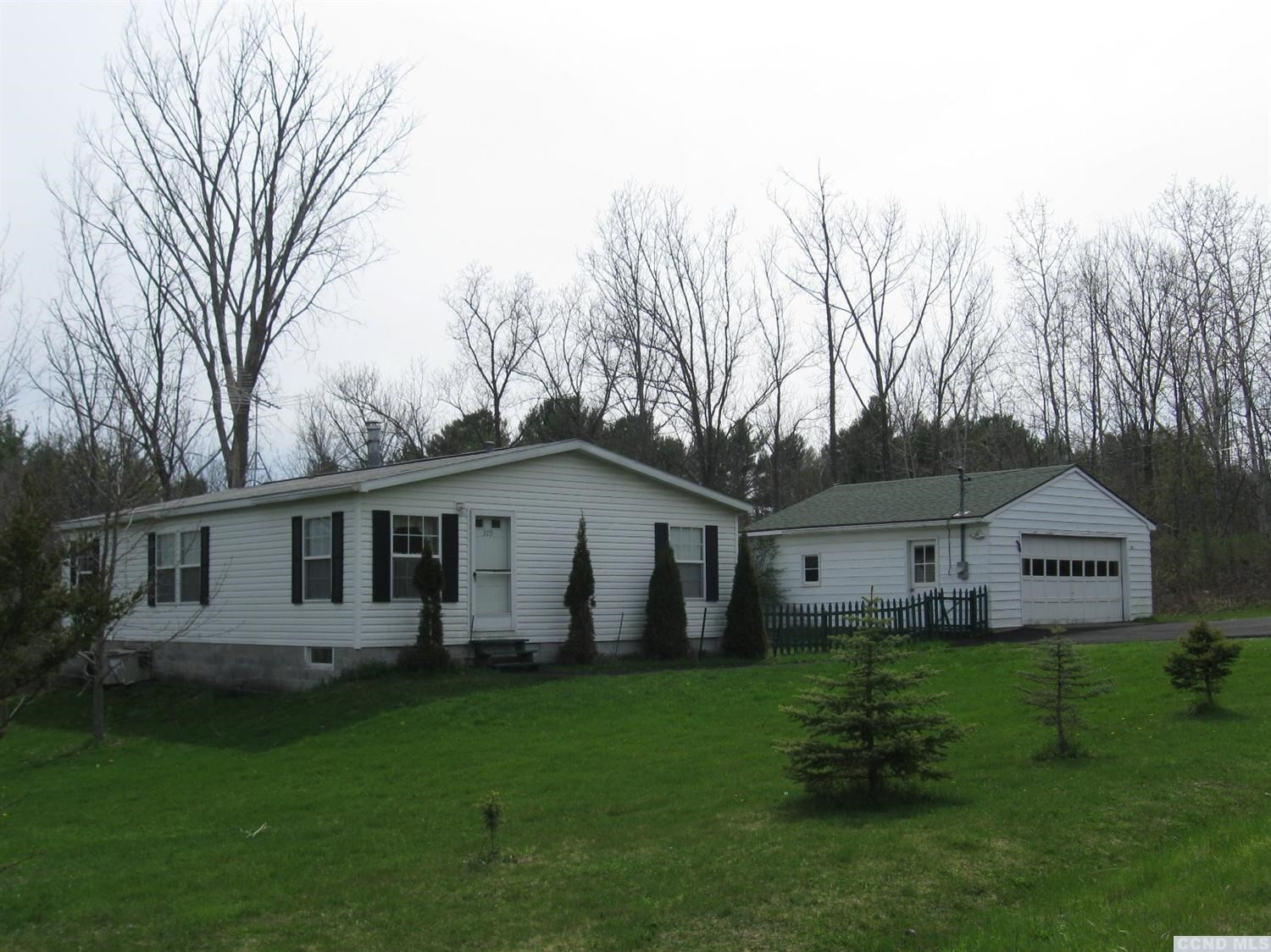 379 Cty Route Medusa, NY 12120 - Photo 1 of 10 a view of a yard in front of a house with large trees