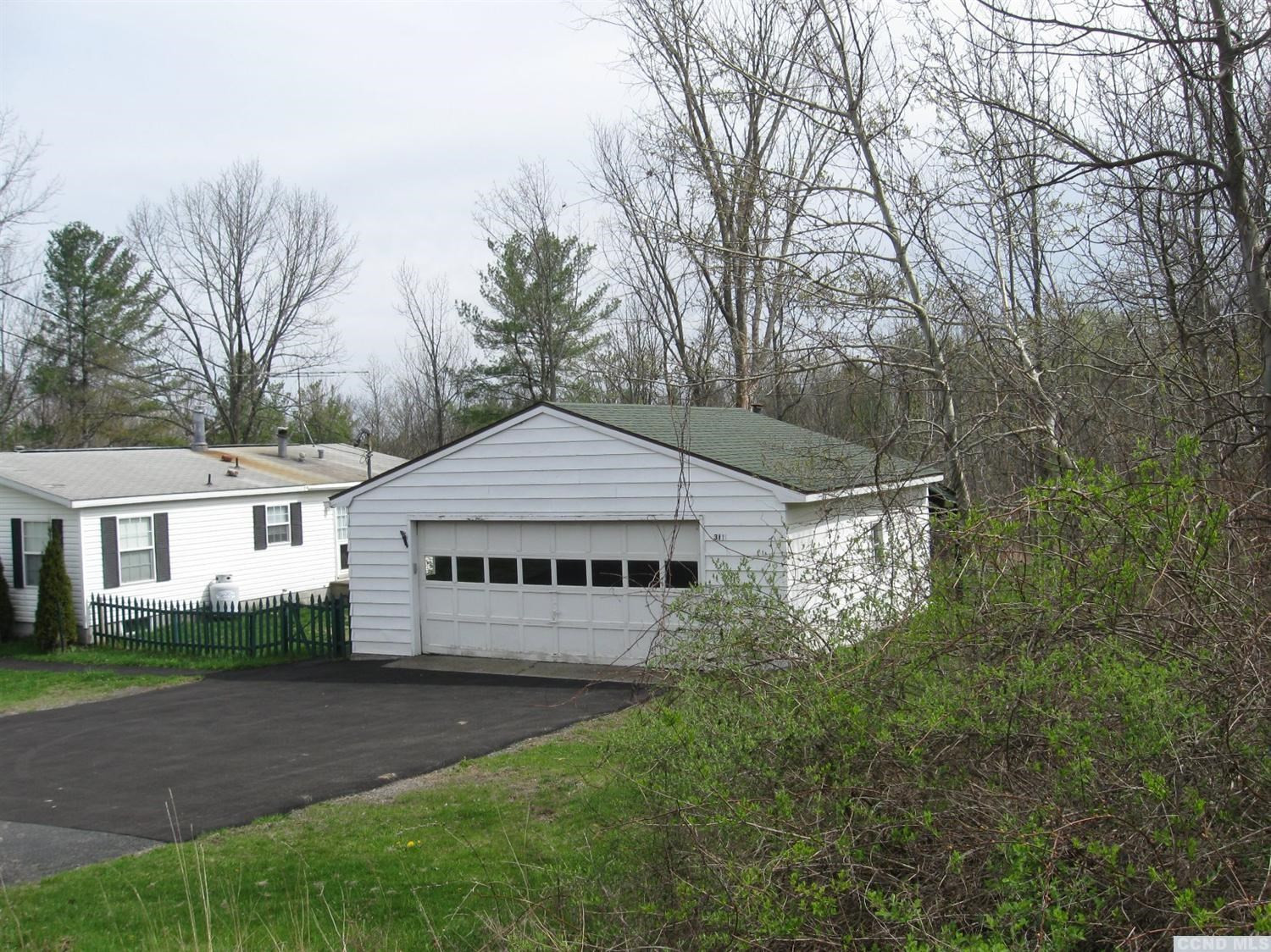 379 Cty Route Medusa, NY 12120 - Photo 3 of 10 a front view of a house with a yard and garage