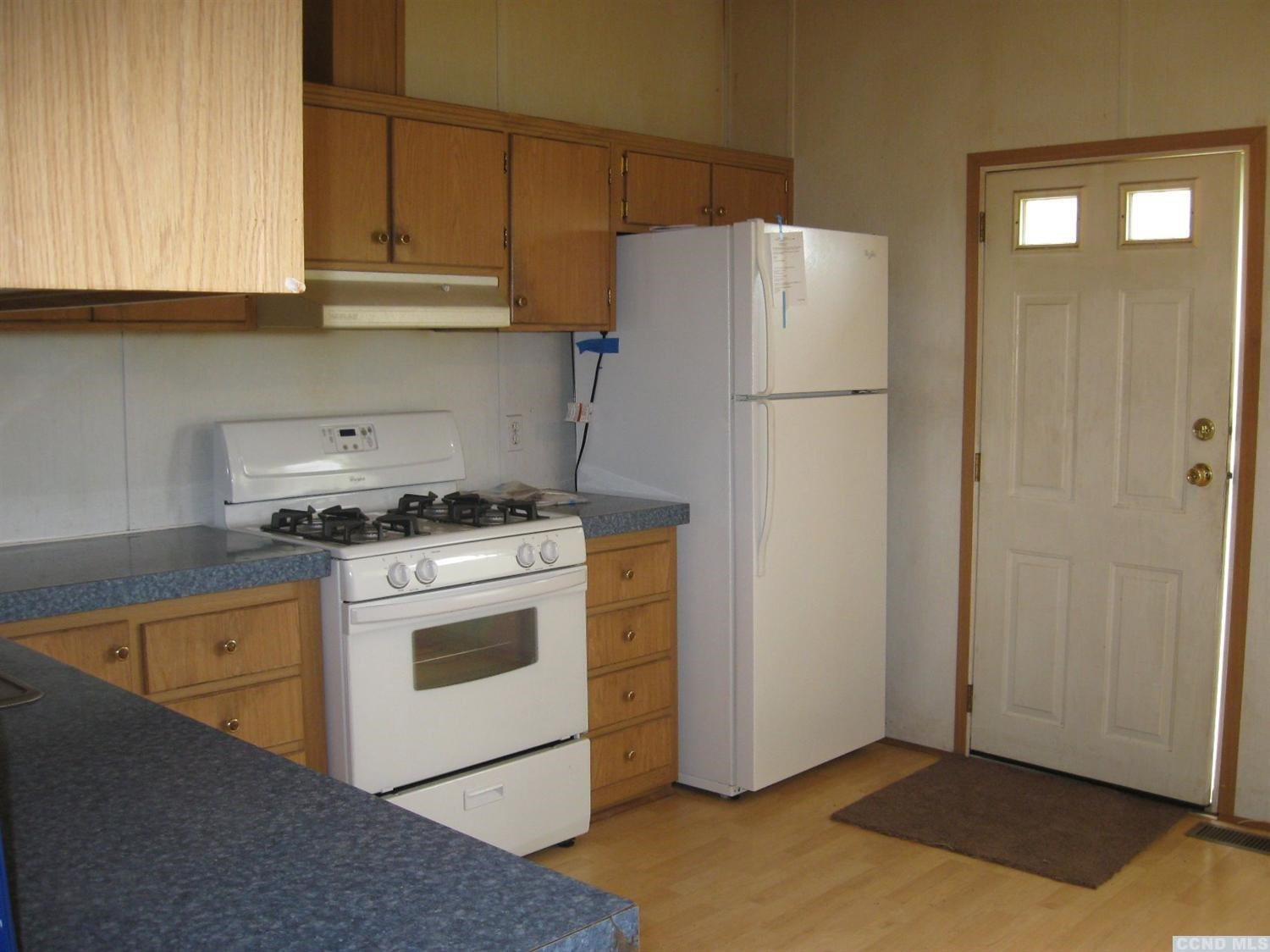 379 Cty Route Medusa, NY 12120 - Photo 5 of 10 a kitchen with a refrigerator sink stove and cabinets