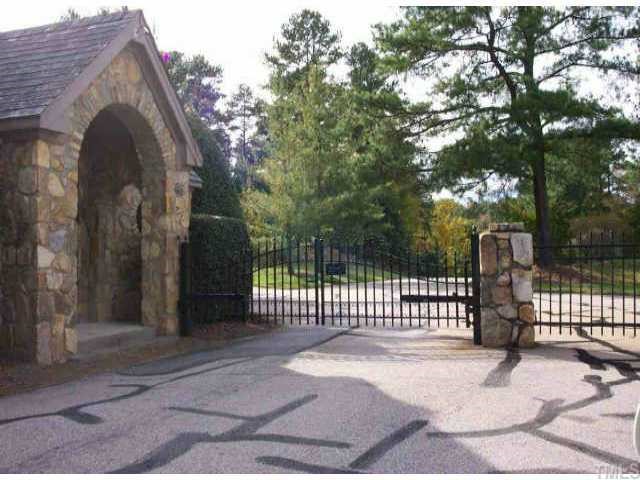 1328 Adams Mountain Road Raleigh, NC 27614 - Photo 1 of 1 a view of entrance gate of house with wooden fence